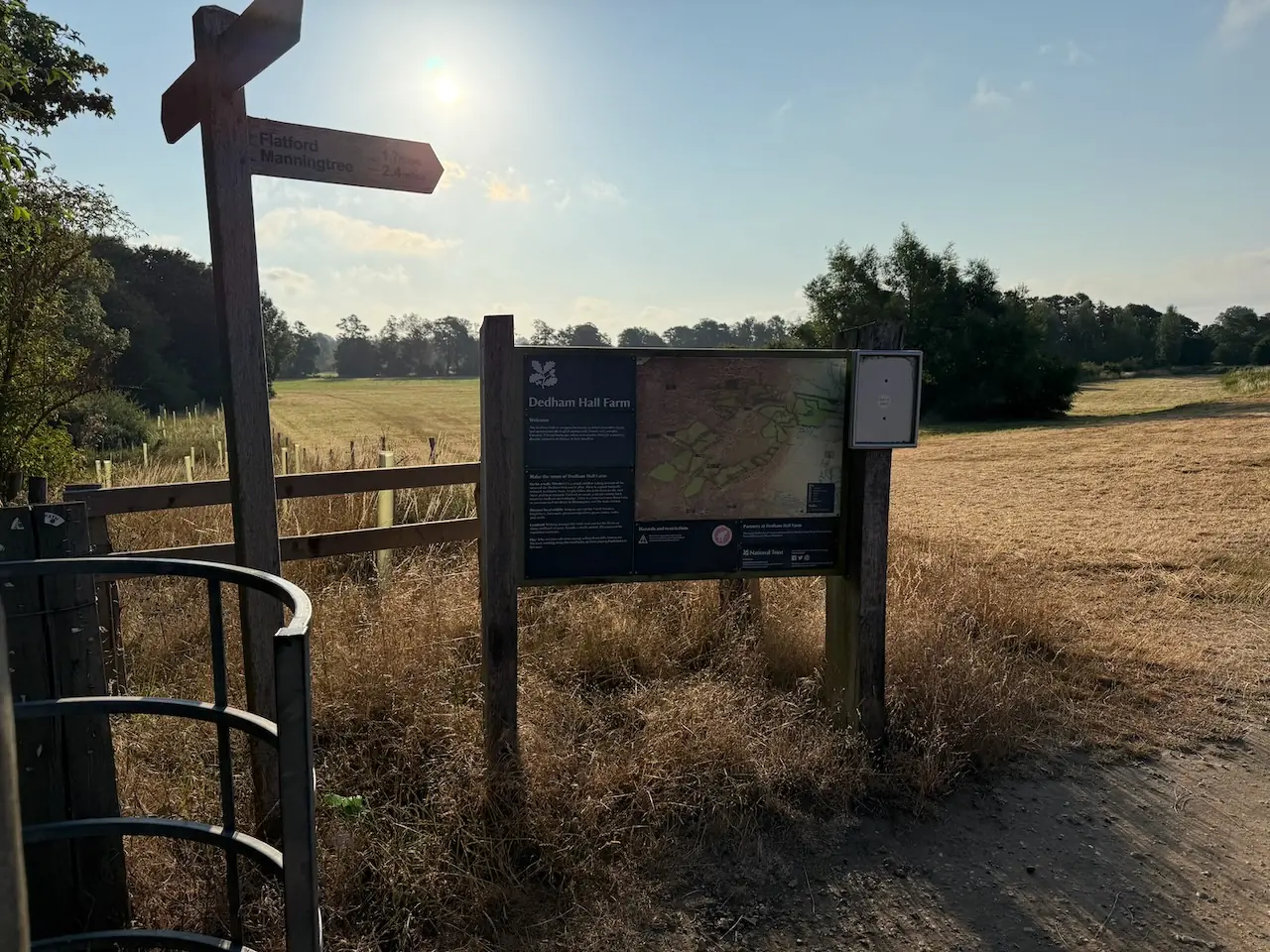 Public footpath signs and a route map at the start