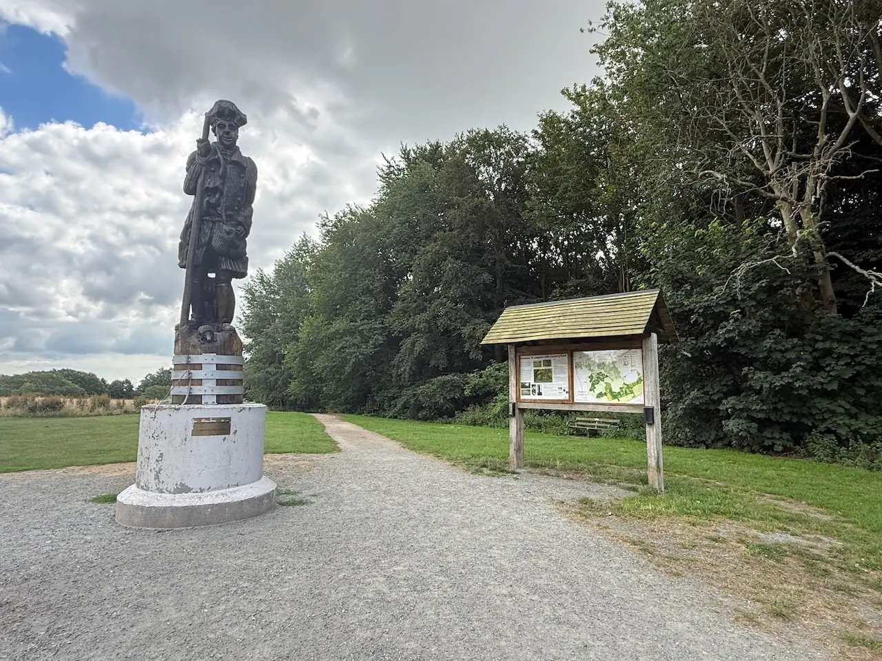 Statue and information board
