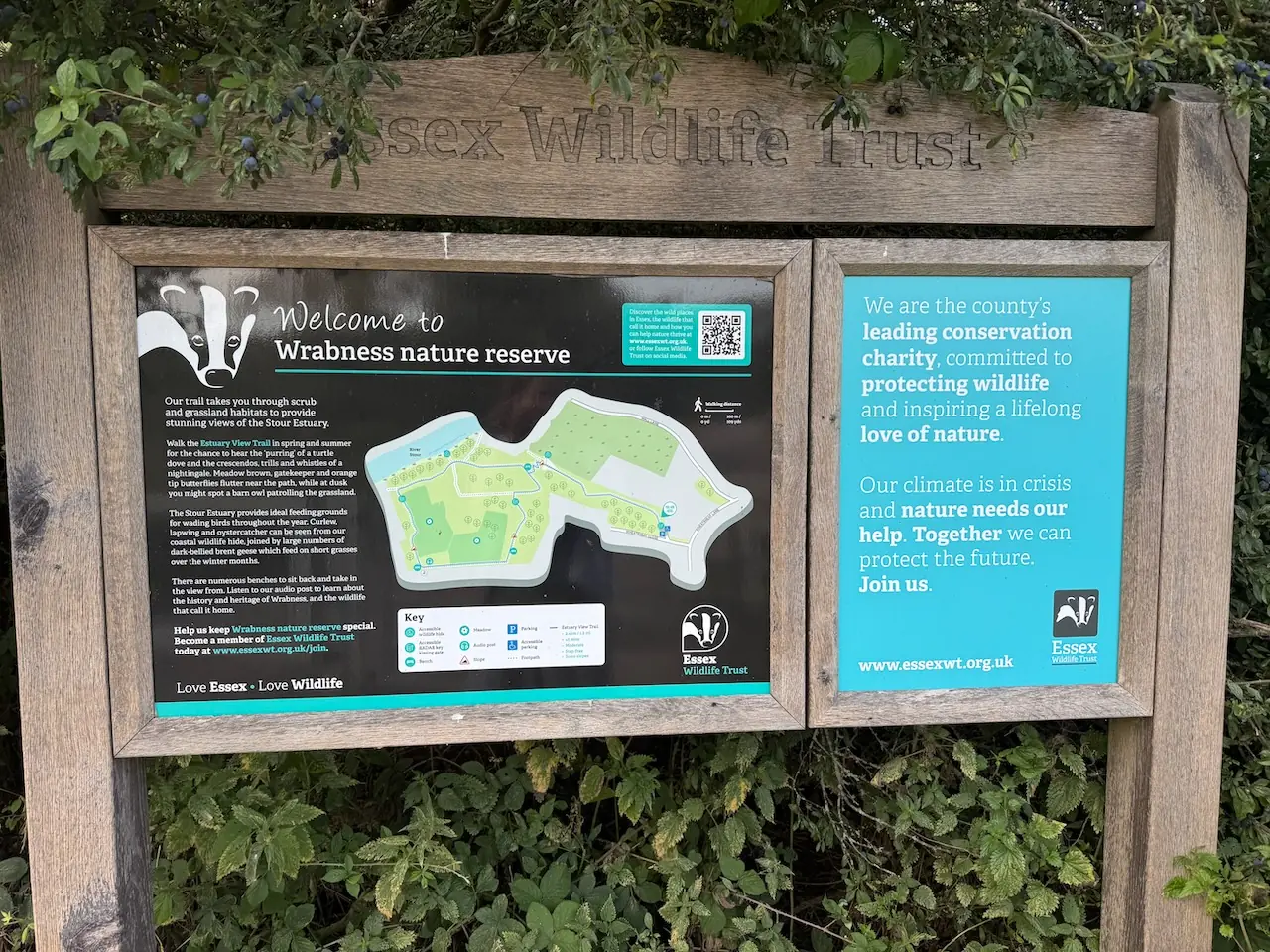 The Essex Wildlife Trust welcome board and trail map at the entrance